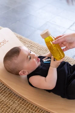 Botella sensorial de oro flotante - Petit Boum